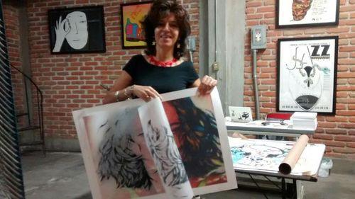 Cárdenas holding a silkscreen print of Medusa in Mexico City via DesertTriangle blog.