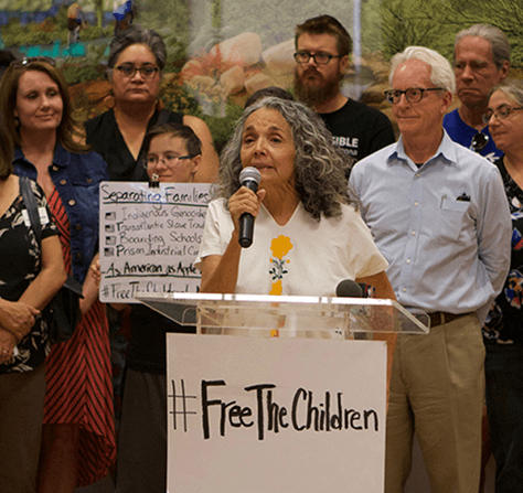  Isabel speaking at the Pima County Board of Supervisors office denouncing then Attorney General Jeff Sessions policy of separating children from their parents at the U.S./Mexico border.