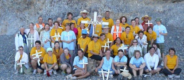 Kat in second row with bright earrings posing with fellow walkers at the Annual Migrant Trail in Arivaca, Arizona. 2013.