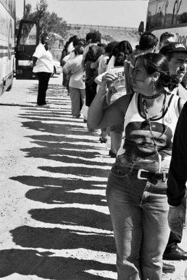 Kat is wearing a Che Guevara shirt standing in line to board the bus for the Immigrant Workers Freedom Ride: "On The Road to Citizenship" sponsored by the AFL-CIO. Heading to Washington DC. 2003.