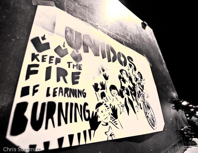 Poster of Unidos, “Keep the Fire of Learning Burning,” 2012. Photo by Chris Summitt.