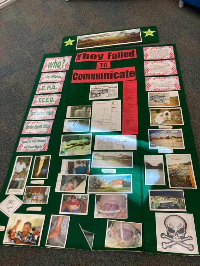 Handmade tri-fold display board with photos of community members visibly affected by toxic contamination.