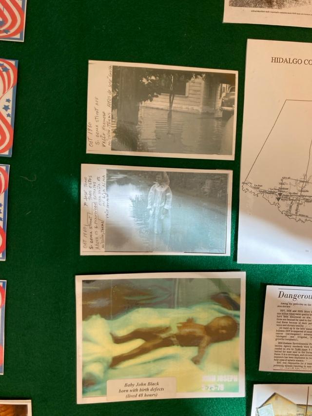 Detail from tri-fold board with photographs of a baby and photographs of neighborhood flooded with contaminated water.