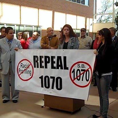 Romero was an opponent of Arizona SB1070, here in an undated photo speaking against the legislation.